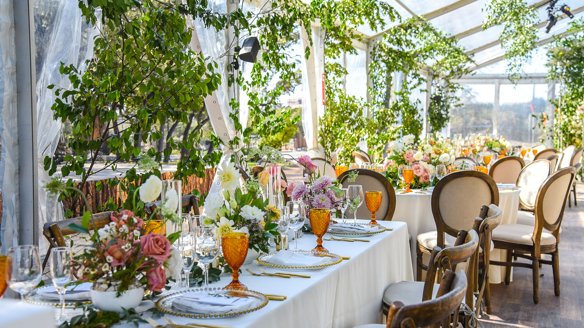 Wedding Tables set up underneath tent
