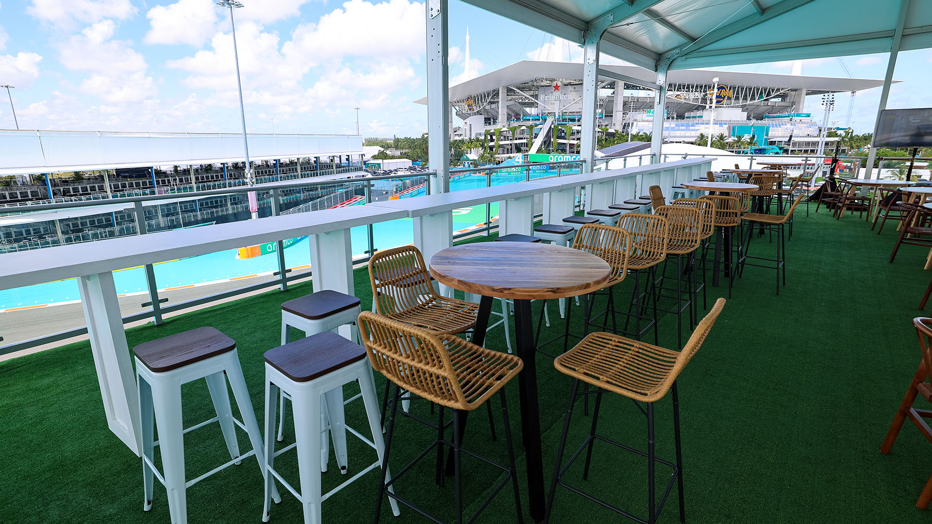 2nd story of structural tent set up with cocktail tables and seating