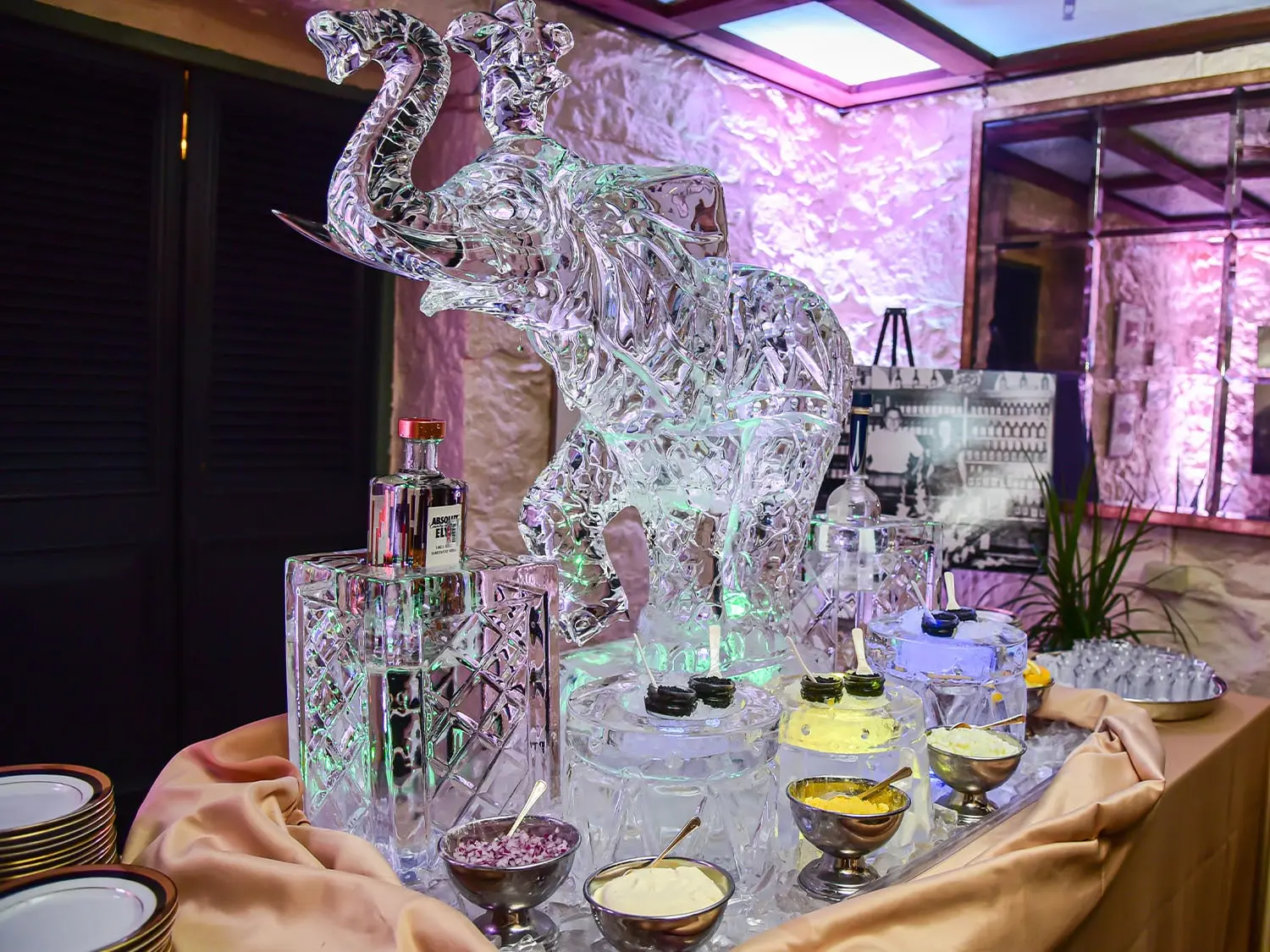 A luxurious caviar station elegantly presented atop a hand-carved ice sculpture, enhancing the dining experience.